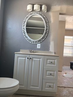 Sink with furniture and mirror