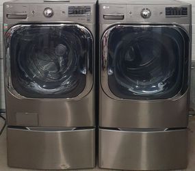 LIKE NEW  - LG SET WASHER WITH TURBOWASH STEAMAND GAS DRYER WITH PEDESTALS