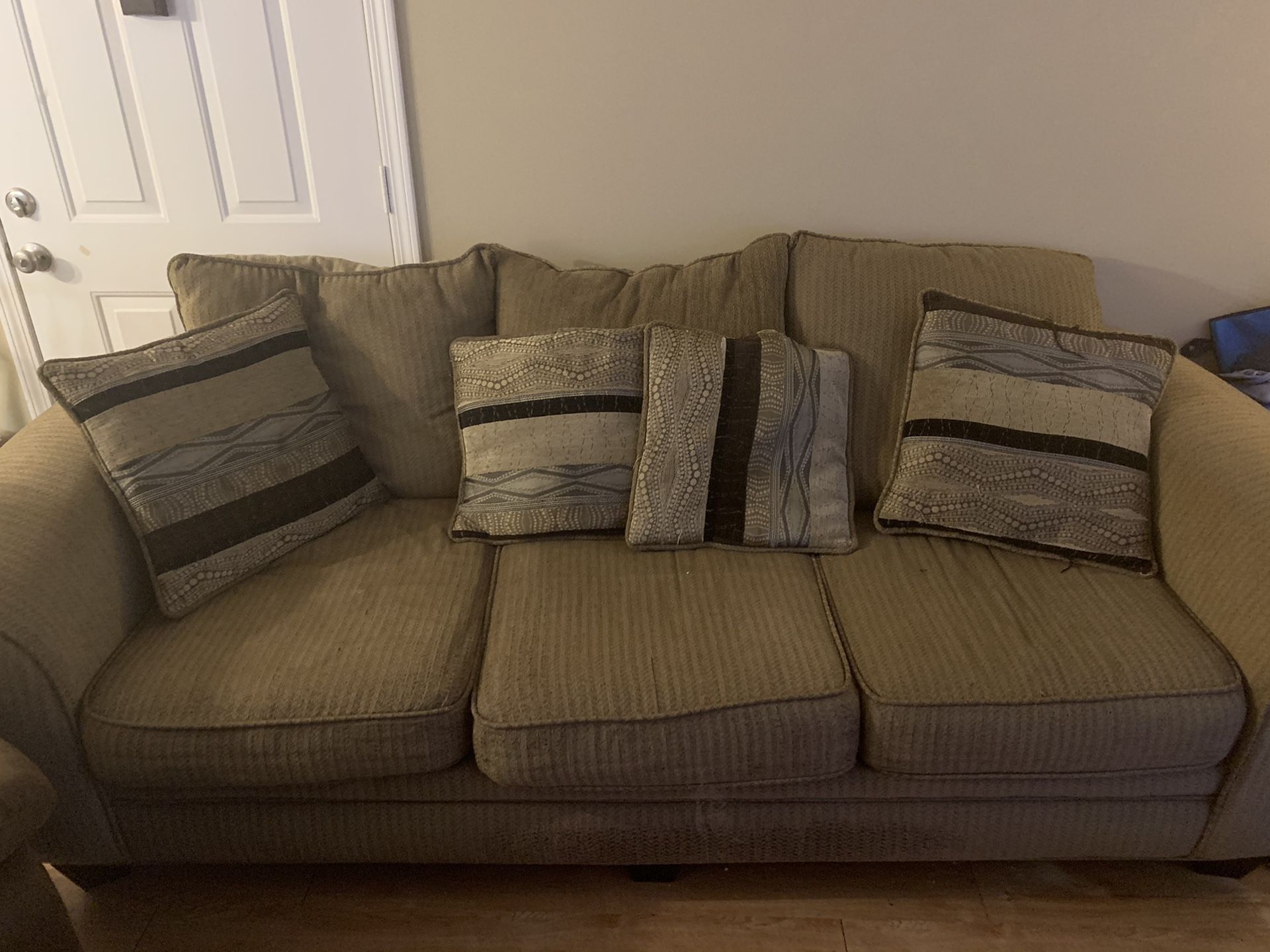 Couch with pillows and ottoman