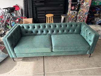 Green tufted couch