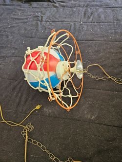 This is a vintage 1970s Harlem Globetrotters style basketball hoop hanging swag lamp.