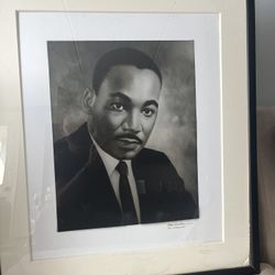 Photograph of Martin Luther King. Black and white photograph 27Wx31H. Black frame with white Matt.