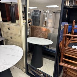 full-length black-framed floor mirror - 27” x 65”.  