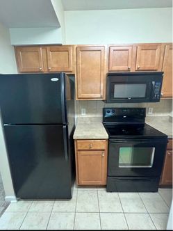 Four piece black kitchen appliances set