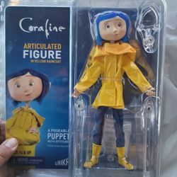 CORALINE ARTICULATED FIGURE IN YELLOW RAINCOAT