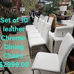 Chairs set of 10,, White Faux Leather  w/ Chrome base We are located at 2811 East Bell road. Another Time Around Furniture.