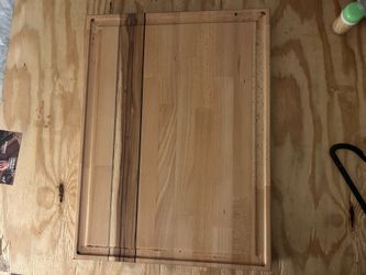 Large butcher block cutting board.