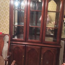 Wood China cabinet with matching table 6 chairs included