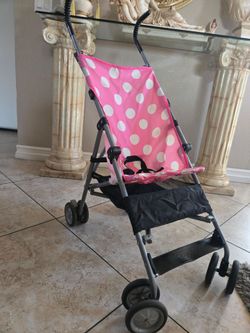 Folding stroller with compartment under the seat.