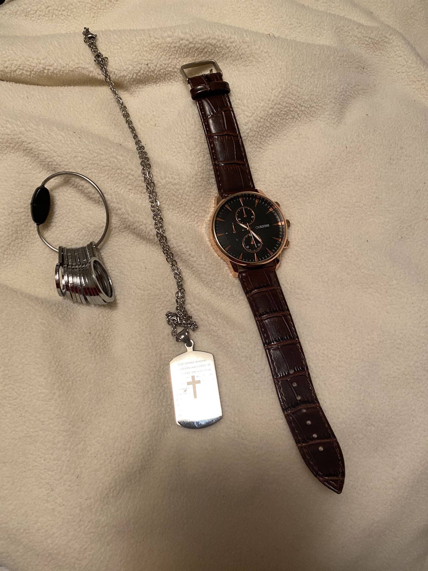 Watch, Ring Sizer, And Stainless Steel Cross Necklace