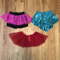 3 kids skirts/skorts for dance/dress up/costumes in excellent condition. Stretchy so they fit from about a 3-6/7
