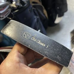 Golf putter club classics in right hand  34