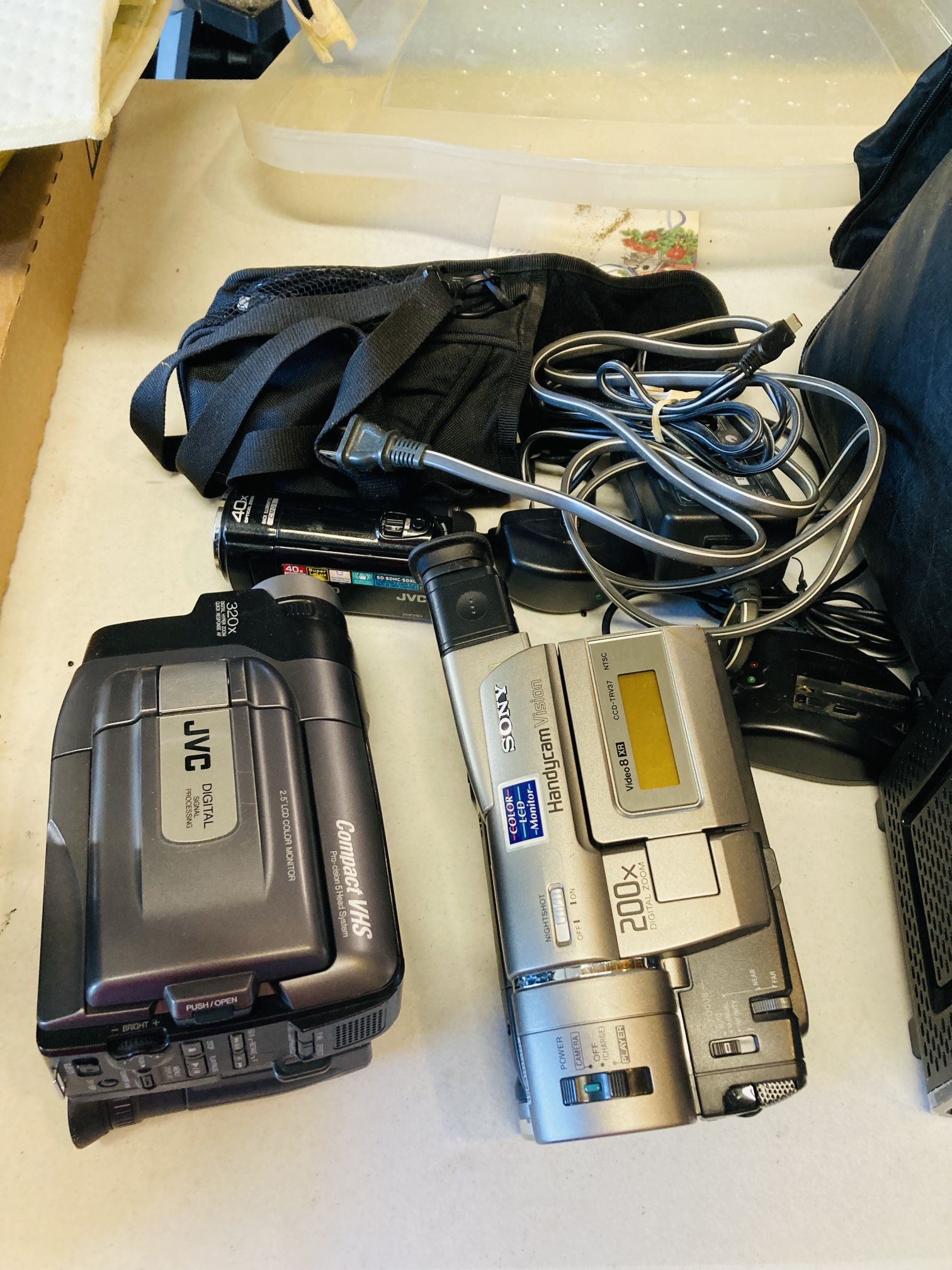 Three Video Camcorders And A Cable Extender 