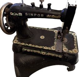 vintage Sinpor brand sewing machine from the early 20th century