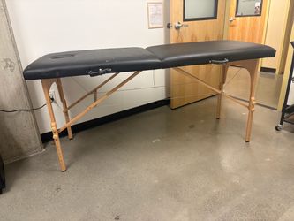 (worn) black massage bed, travel