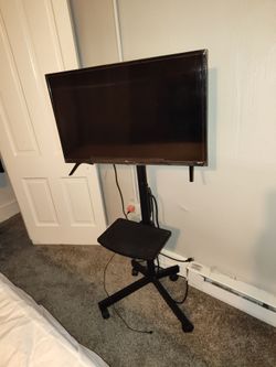 32" TCL ROKU TV with stand