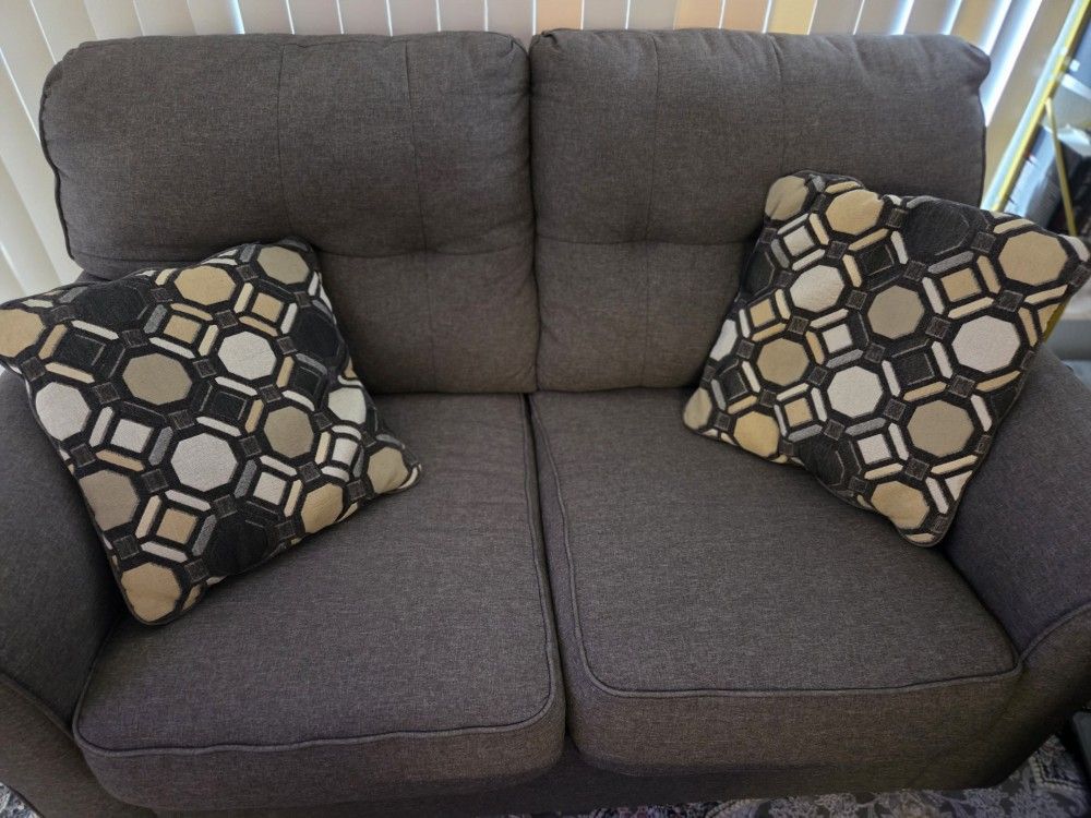 two sets of couches big and small