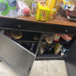 cabinet for storing dishes and utensils