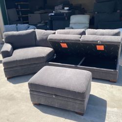 FABRIC SECTIONAL WITH STORAGE SEATS AND STORAGE OTTOMAN 