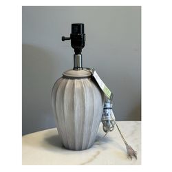 Brand new Threshold Small Ribber Wood Lamp Base - Gray   Includes: 1 Table Lamp Base, Light Bulbs Not Included Dimensions (Overall): 12.25 Inches (H) 