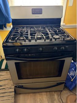6 range gas stove… black and sliver