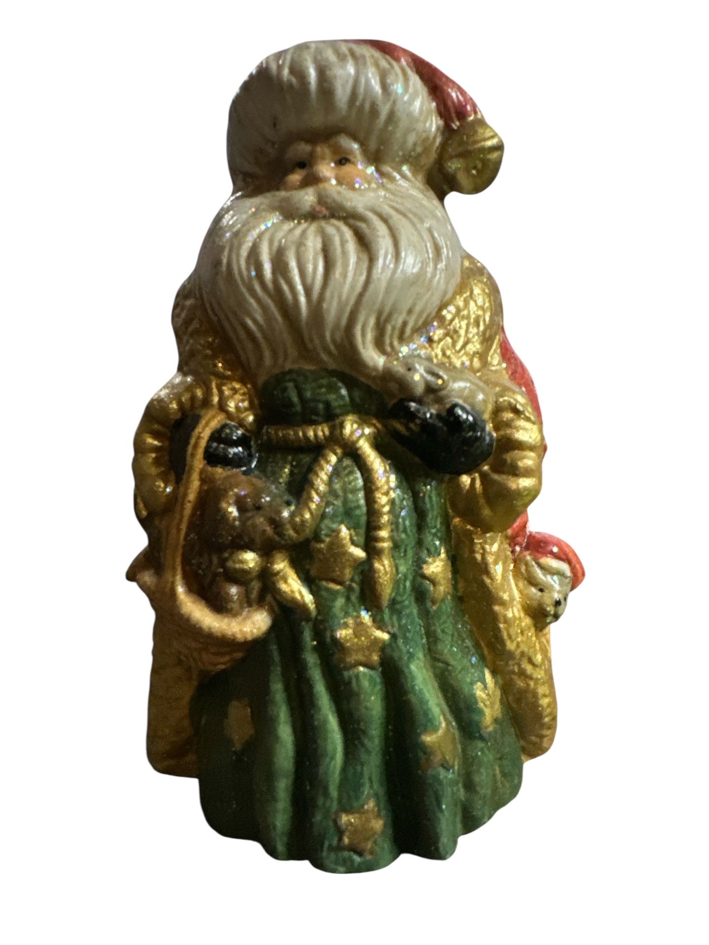 Santa Claus ceramic figurine. The figurine is approximately 6 inches tall. It depicts Santa Claus with two puppies. The figurine appears to be hand-p