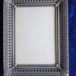 Metal, and rope looking frame