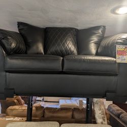 Loveseat. Ashley Furniture. Black. Pleather