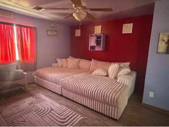 Two sofas and a fridge