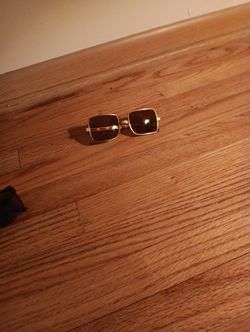 Vintage Men's Cool-Ray Polaroid Sunglasses featuring a gold-toned metal frame. 