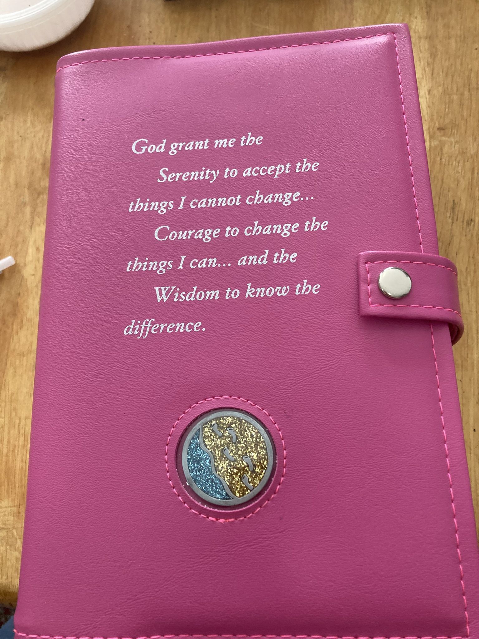 The "3- books in 1 Serenity Prayer and medallion holder, typically refers to a cover designed