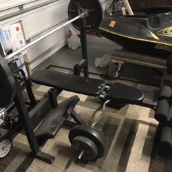 Weight Bench And Curl Bar With Olympic Weights and Bar