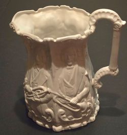 Antique White Ceramic Relief Pitcher