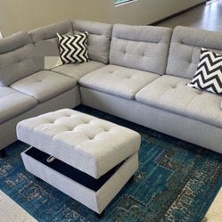 Sectional Sofa with storage ottoman and 2 accent pillows. 