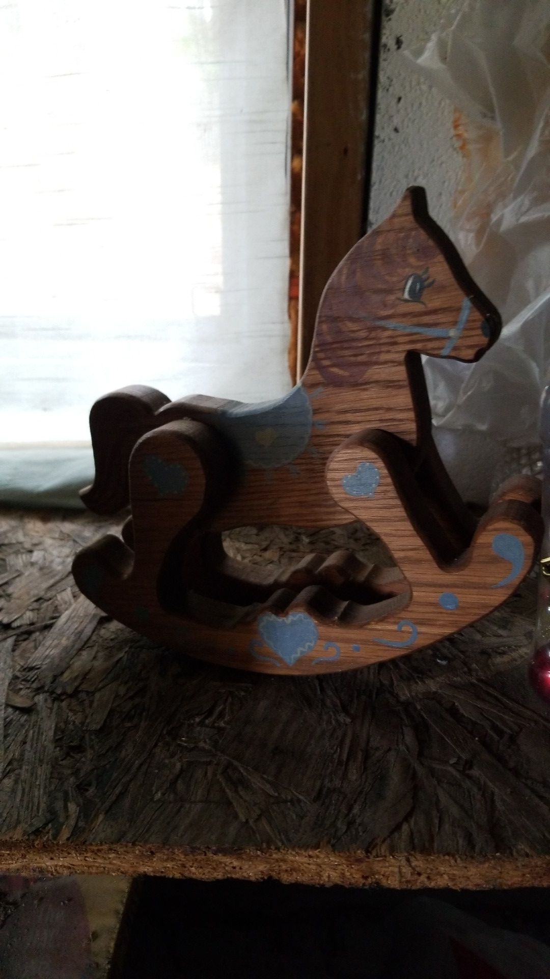 Small toy wooden rocking horse