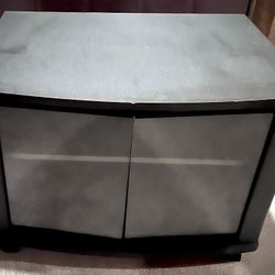 small TV stand with two glass doors