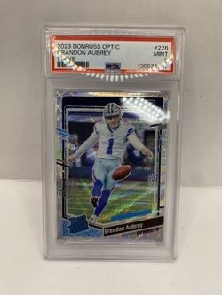 2023 Brandon Aubrey Panini Donruss Optic Rookie Silver Wave Prizm SP RC /300 PSA 9
