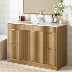 2381f $150 48-inch bathroom vanity (sink not included) in a natural oak finish. Modern-style vanity featuring a vertical-slat finish, complete with a 