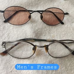 (2)- Pairs of men's eyeglasses. Both with metal frames, 1  in black, and 1 in Chrome. 
**** Don't know the prescriptions on the lens.