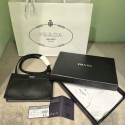 100% Authentic PRADA Saffiano Leather Crossbody Phone Bag – Nero (Black) Silver-Tone  Item Details: 	•	Brand: PRADA 	•	Style: Flat Crossbody / Cellpho