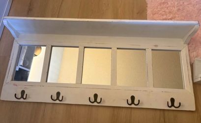 White shelf with hooks