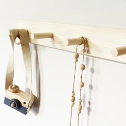 Wooden pegs rack