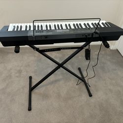 Casio Musical Keyboard With Stand.