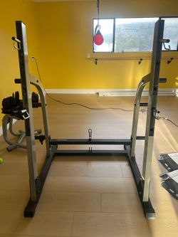 Nautilus Squat Rack, Weight Plates, Bars, & Bench