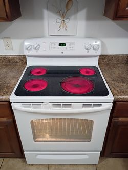 GE, White Electric Stove.