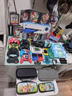 Selling All these games , controllers,  power cirds, phone cases, new phone, and  more items,  everything for 200. Everything in Good condition. 

11 