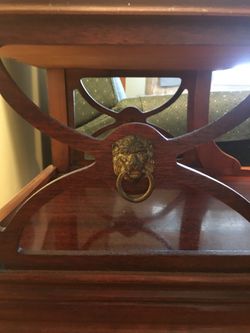 Antique side table with lion medallion