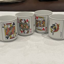 Set of 4 ceramic mugs featuring playing card designs. Jack, Queen, King, Joker
