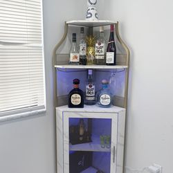 Corner bar cabinet with LED lights white gold