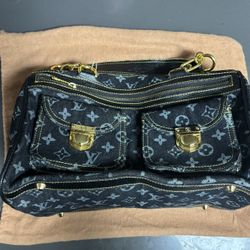 Louis Vuitton Monogram Denim Neo Speedy handbag in blue denim with gold-tone hardware. 
